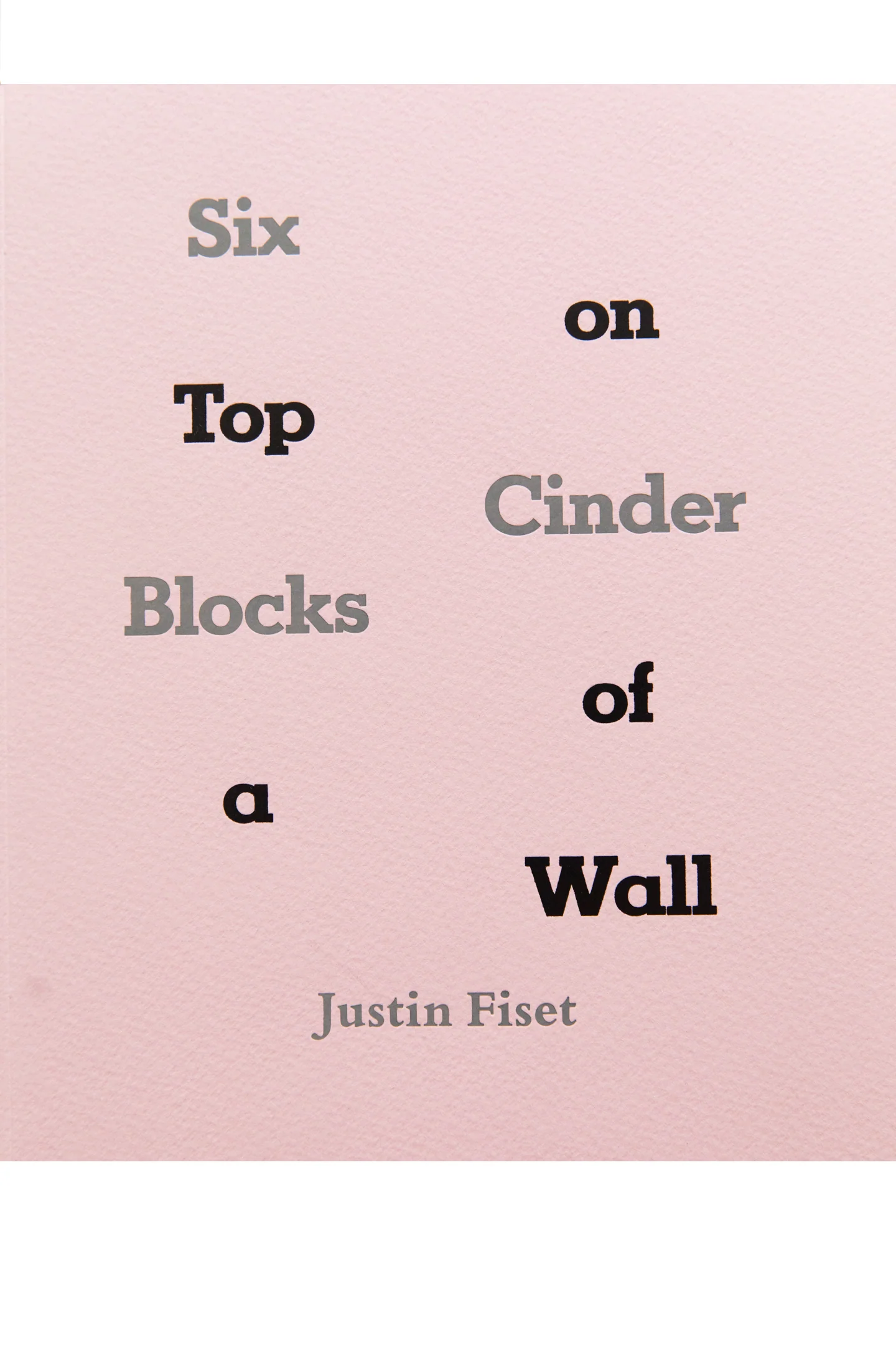 SIX CINDER BLOCKS ON TOP OF A WALL